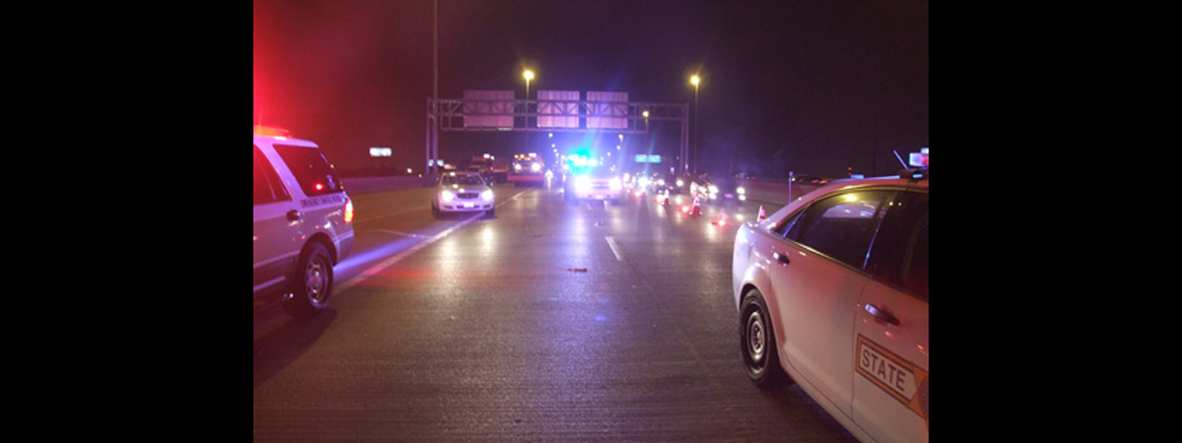 Squad Cars on Interstate at Night Tending to Accident